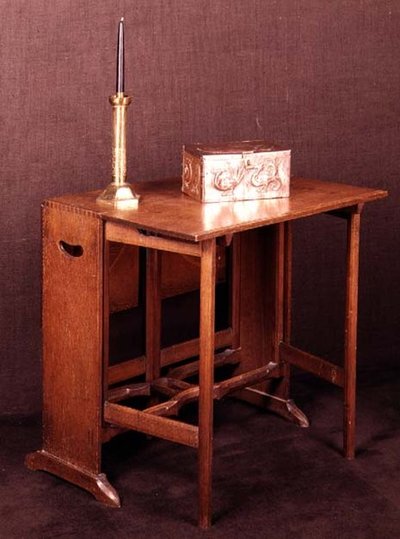 Arts and Crafts table, casket and candlestick, late 19th century by English School